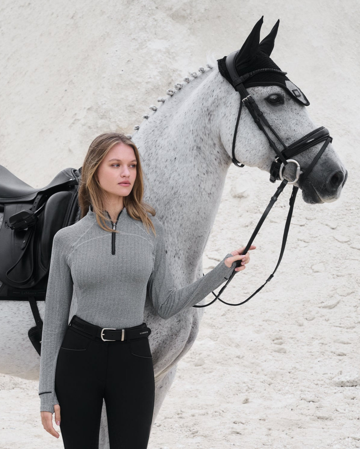 LeMieux Aspen Herringbone Base Layer; shown on woman outdoors next to horse  | Ladies' Athleisure | Malvern Saddlery