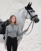 LeMieux Aspen Herringbone Base Layer; shown on woman outdoors next to horse  | Ladies' Athleisure | Malvern Saddlery