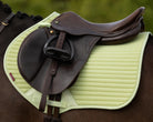 LeMieux Air-Tek Close Contact Square - Macaron [lt green]; close up shown on horse with saddle, blurred outdoor background | Jumper Saddle Pads