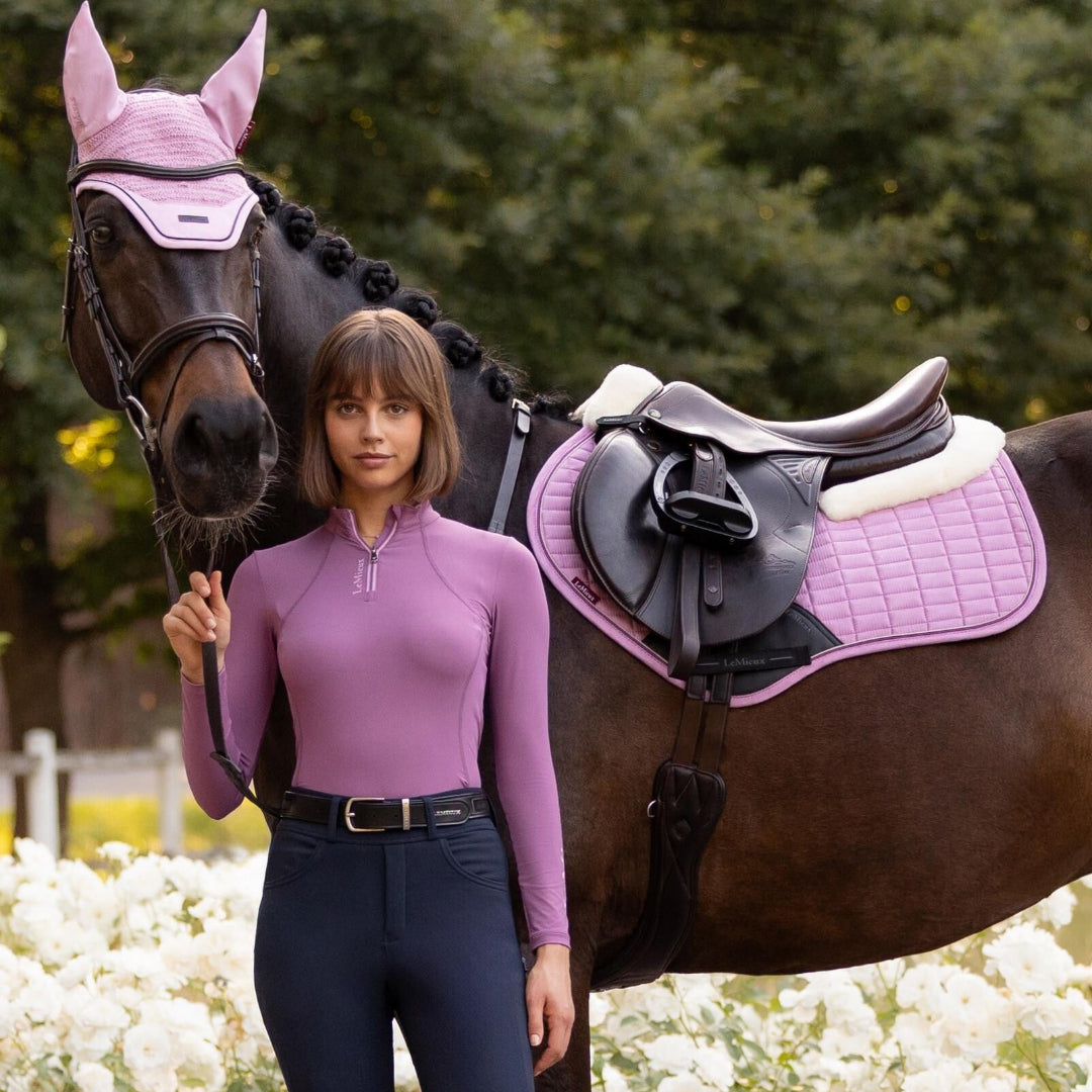 LeMieux Merino+ Suede Close Contact Square Saddle Pad - Fondant Pink; on horse with rider, outdoors | Malvern Saddlery