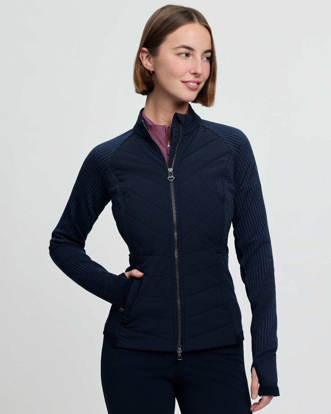 LeMieux Women's Maddie Hybrid Jacket - Navy; shown on person, white background  | Riding Apparel | Malvern Saddlery