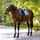 LeMieux Essence Close Contact Square Saddle Pad - Powder Blue; on chestnut horse with brown saddle outdoor background | Tack Shop | Malvern Saddlery