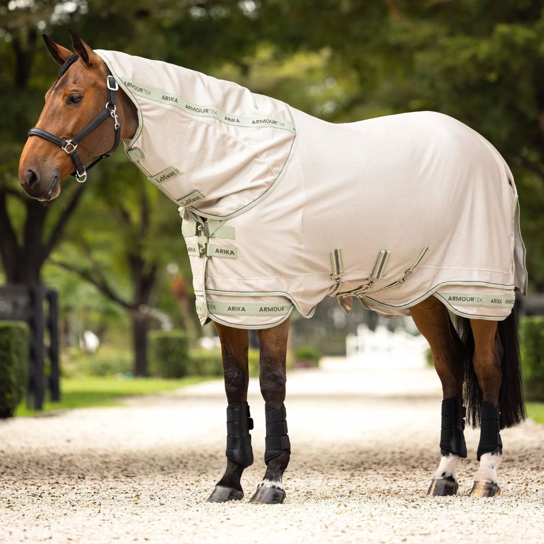 LeMieux Arika Armour-Tek Flysheet - Stone; shown on brown horse on tree lined gravel road | Malvern Saddlery
