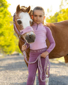 LeMieux Mini Base Layer Top - Fondant Pink; shown on girl with pony outdoors | Malvern Saddlery