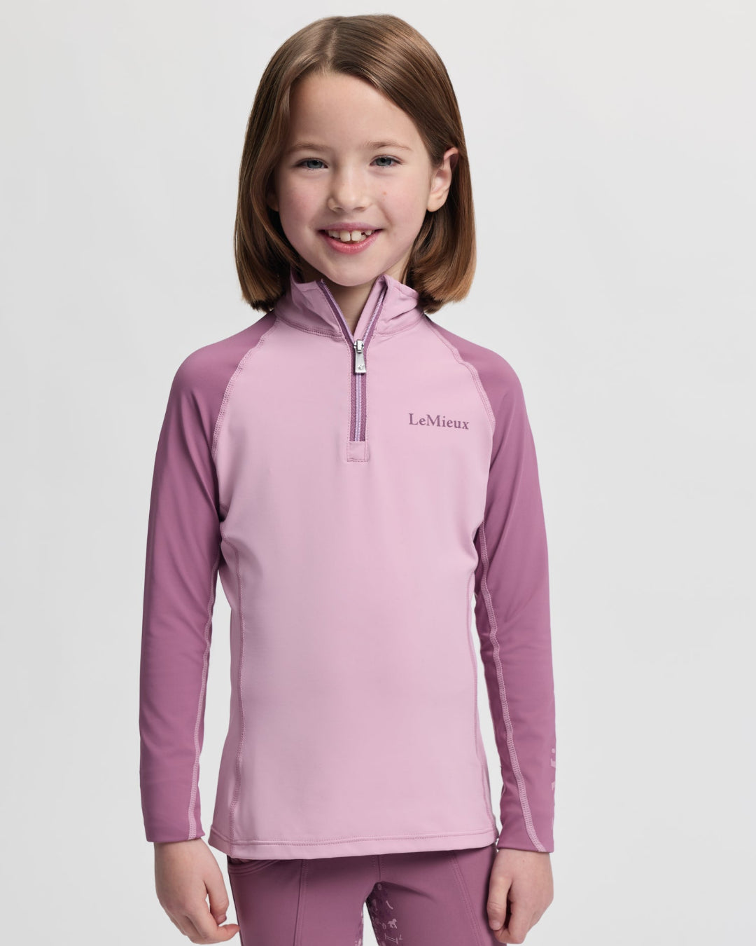 LeMieux Mini Base Layer Top - Fondant Pink; shown on girl | Malvern Saddlery