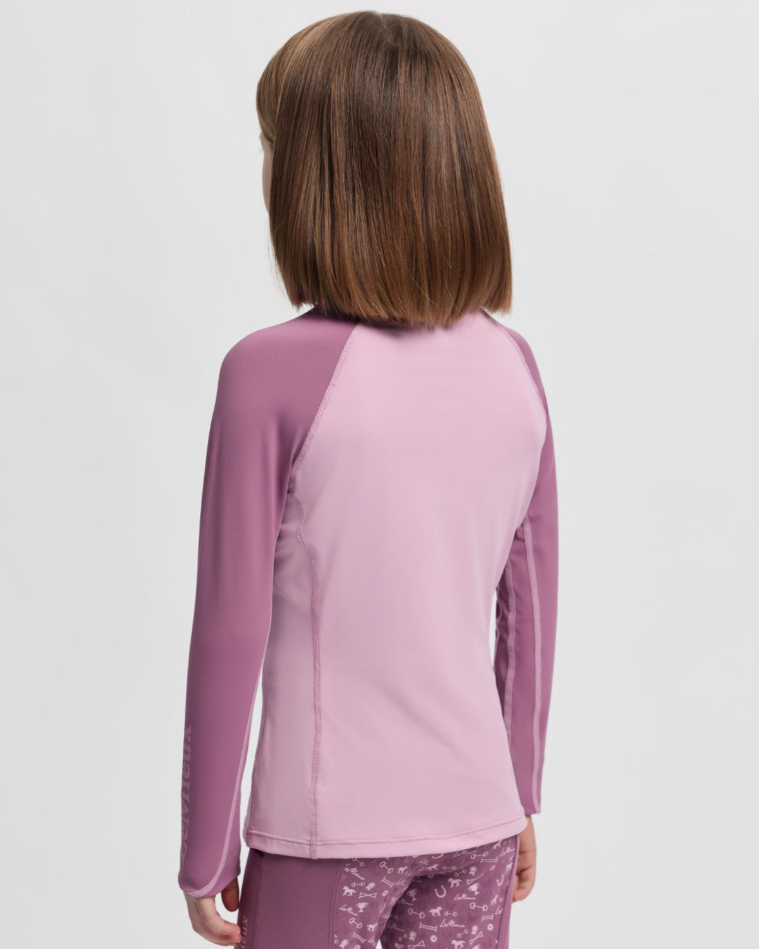 LeMieux Mini Base Layer Top - Fondant Pink; back view shown on girl | Malvern Saddlery