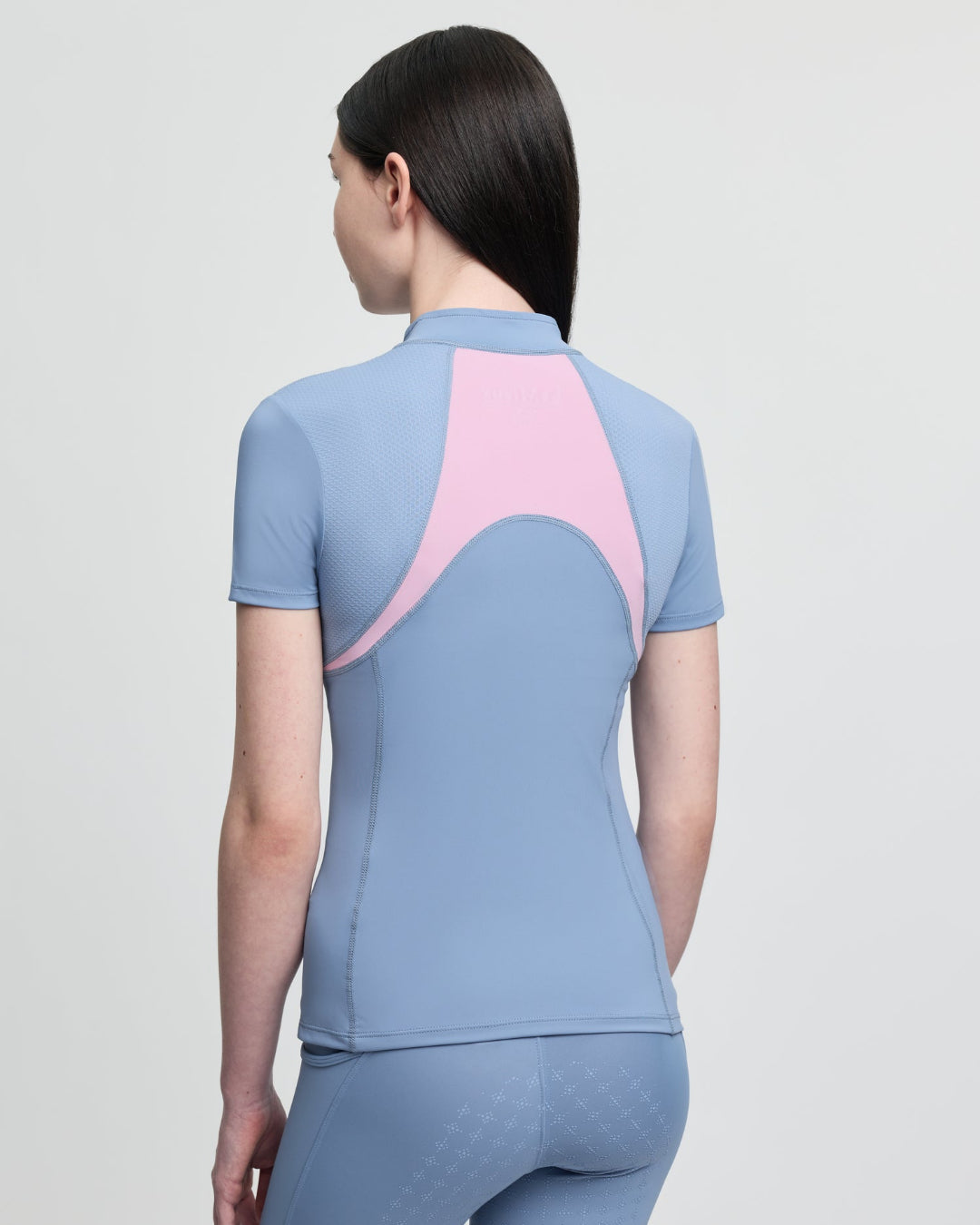 LeMieux Young Rider Short Sleeve Mia Mesh Base Layer - Powder Blue/Fondant Pink; back view on model | Malvern Saddlery