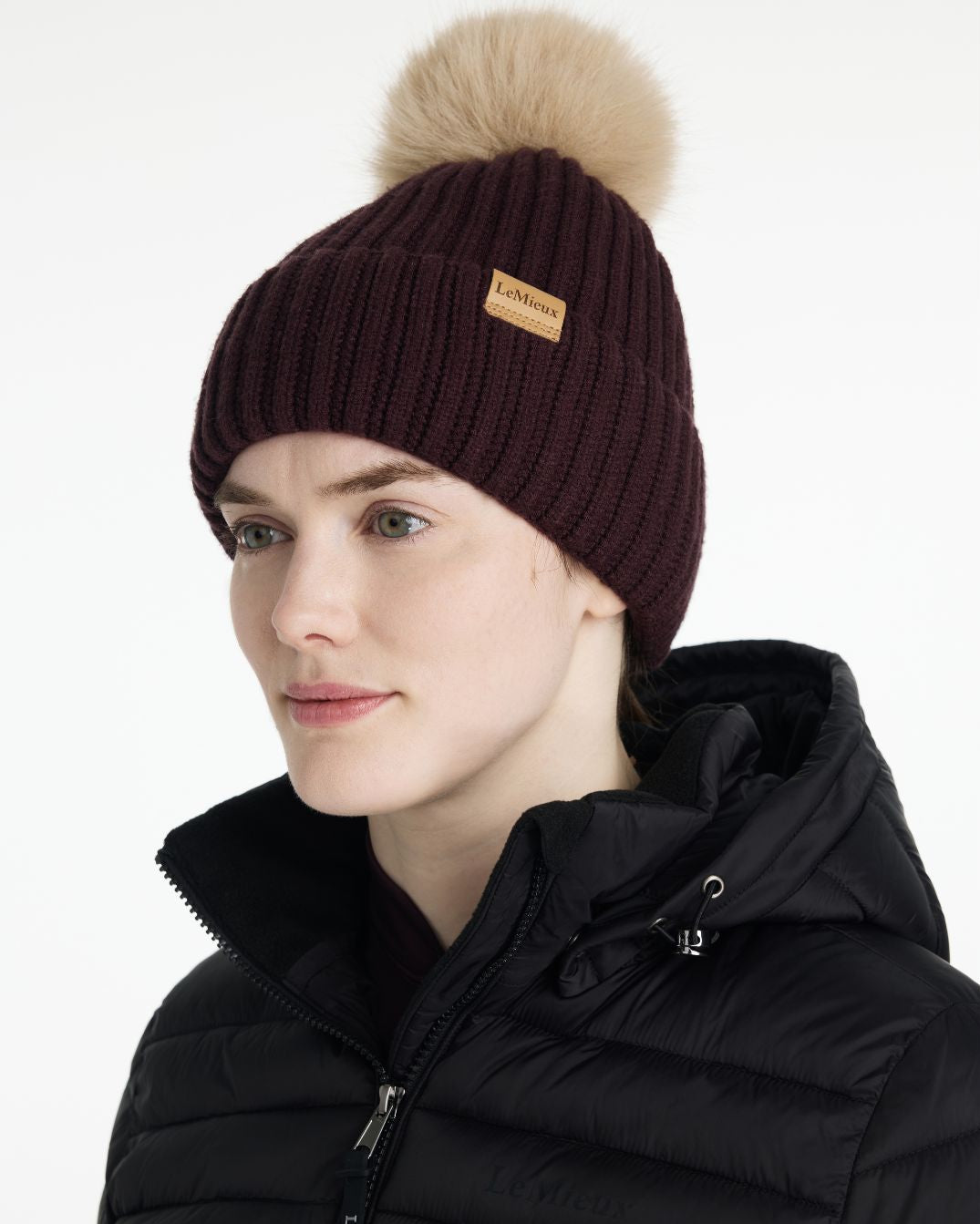 LeMieux Clara Rib Beanie - Damson Dark Red - shown on woman against white background | Winter Hats | Malvern Saddlery