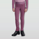 LeMieux Mini Pull On Breech - Mallow Pink; lower body on model, gray background | Malvern Saddlery
