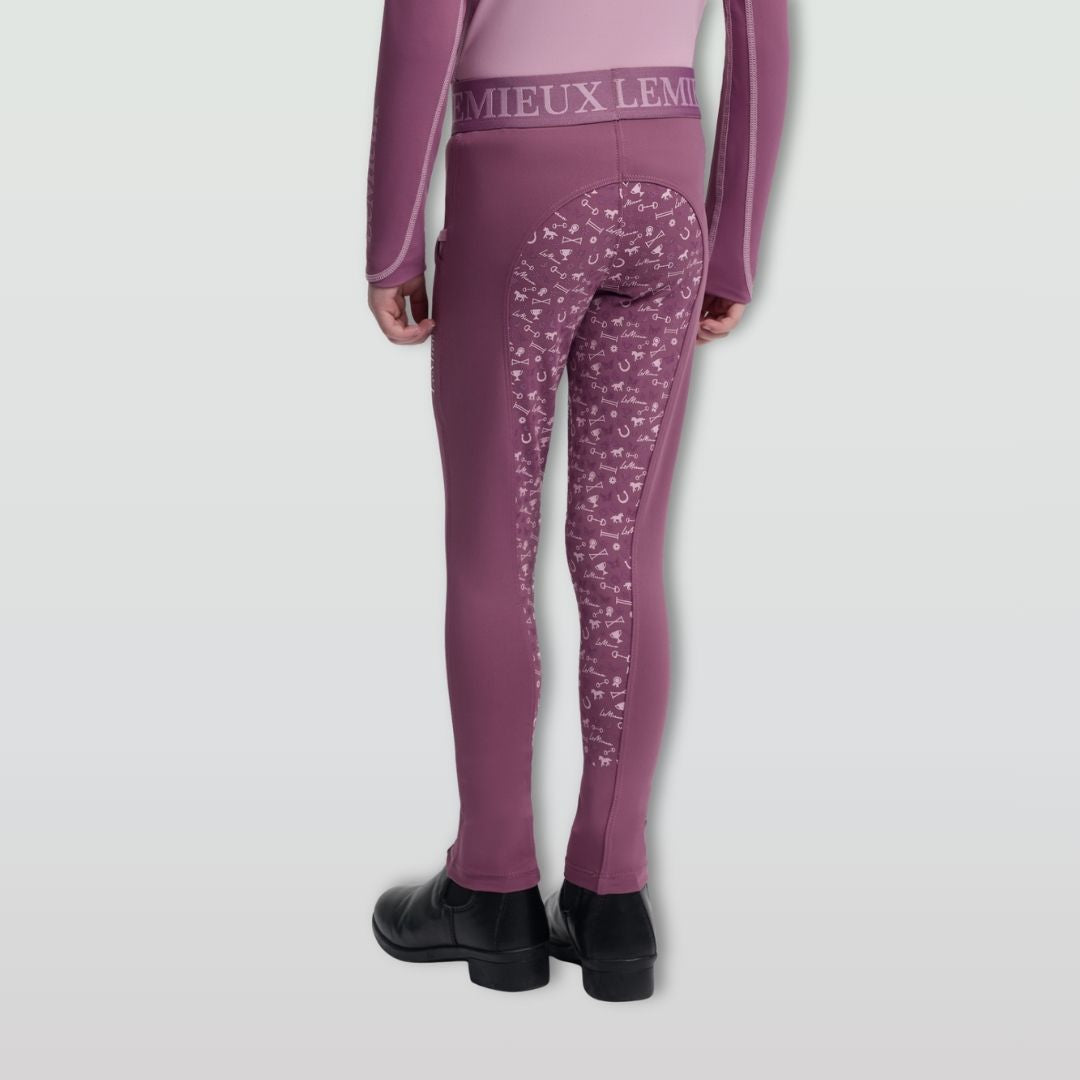 LeMieux Mini Pull On Breech - Mallow Pink; back view lower body on model, gray background | Malvern Saddlery