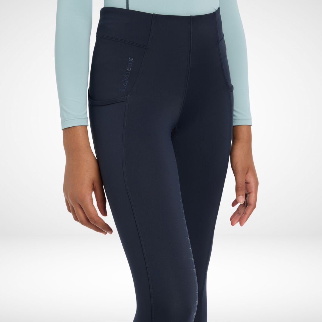 LeMieux Young Rider Orla Pull Ons - Navy, front view knee to waist on model | Malvern Saddlery