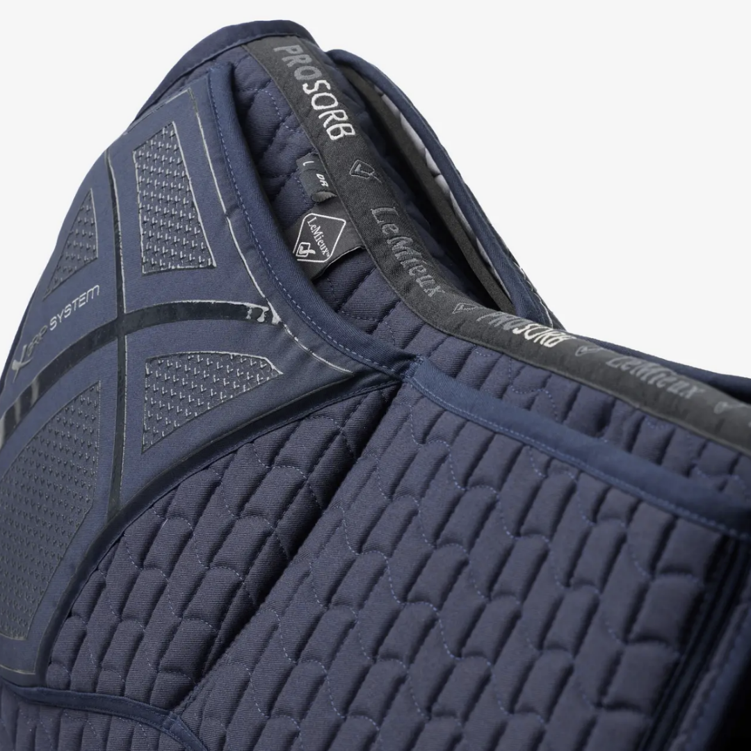 LeMieux ProSorb Plain 2 Pocket Dressage Square Saddle Pad - Navy, close up of pockets, white background | Tack Shop | Malvern Saddlery