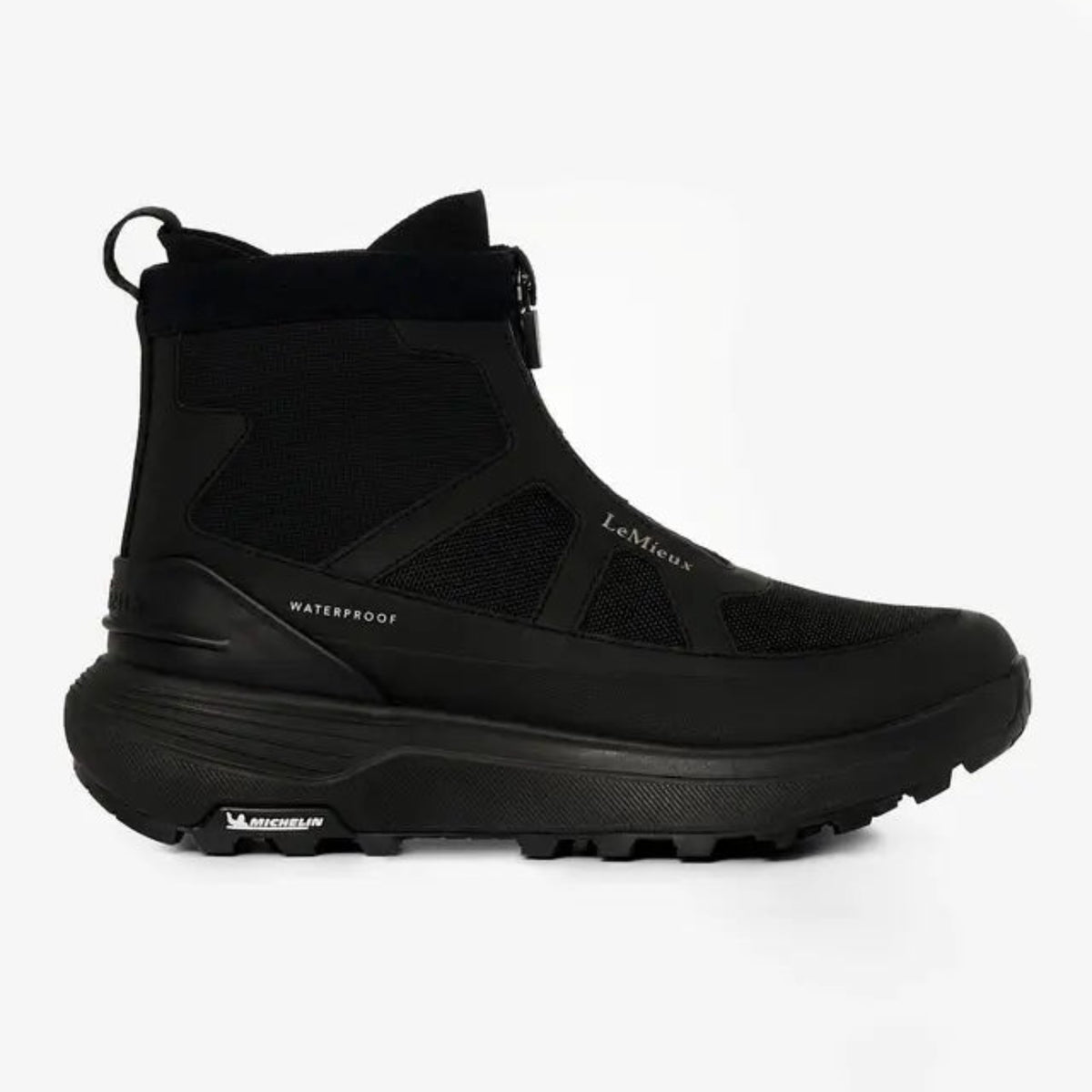 Side view of black LeMieux Cavara Performance High Top Trainer, waterproof equestrian barn boot with Michelin sole and front zipper.