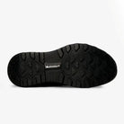 Bottom sole view of black LeMieux Cavara Performance High Top Trainer showing slip-resistant Michelin rubber tread pattern.