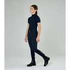 Young rider wearing black LeMieux Junior Zip Paddock Boots with dark navy breeches and top