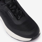 Close-up top view of black LeMieux Kanta Waterproof Sneaker showing durable upper mesh and lace-up closure.