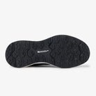 Bottom view of black LeMieux Kanta Waterproof Sneaker showing slip-resistant Michelin rubber outsole tread.
