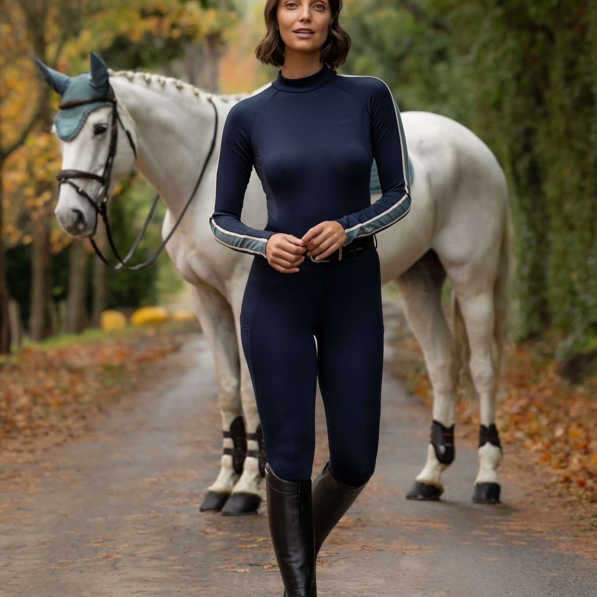 LeMieux Women's Talia Turtle Neck Base Layer - Navy, outdoors with horse | Malvern Saddlery
