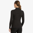 LeMieux Mia Mesh Women's Long Sleeve Base Layer - black; back view shown on woman, gray background | Malvern Saddlery