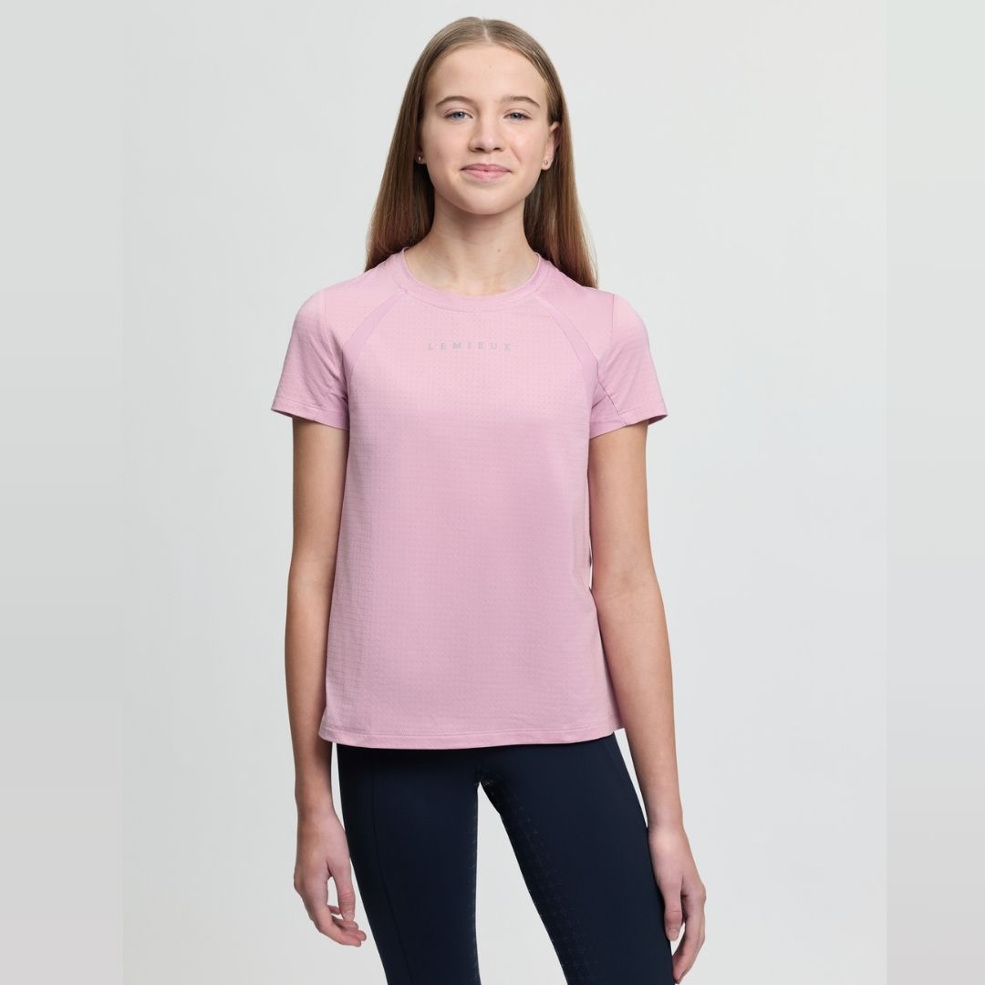 LeMieux Young Rider Sports T-Shirt - Fondant Pink; worn by girl on gray background | Malvern Saddlery