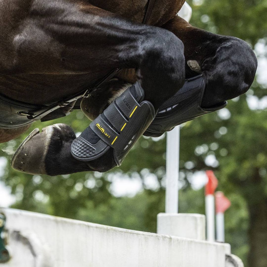 LeMieux MIMsafe XC Boots - front, detail on brown horse jumping | Tack Shop | Malvern Saddlery