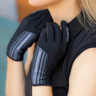 Rider wearing Roeckl Messara black riding gloves for warm-weather riding