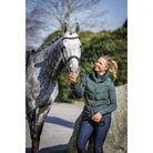 Schockemöhle Marleen Style Women's Padded Vest in Bottle worn with a horse