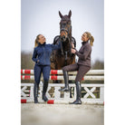Schockemöhle Ricarda Women's Jersey Jacket in Dark Navy worn with a horse