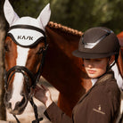 KASK Equestrian Star Lady Chrome Helmet - Brown tone-on-tone, shown on rider next to horse | Malvern Saddlery