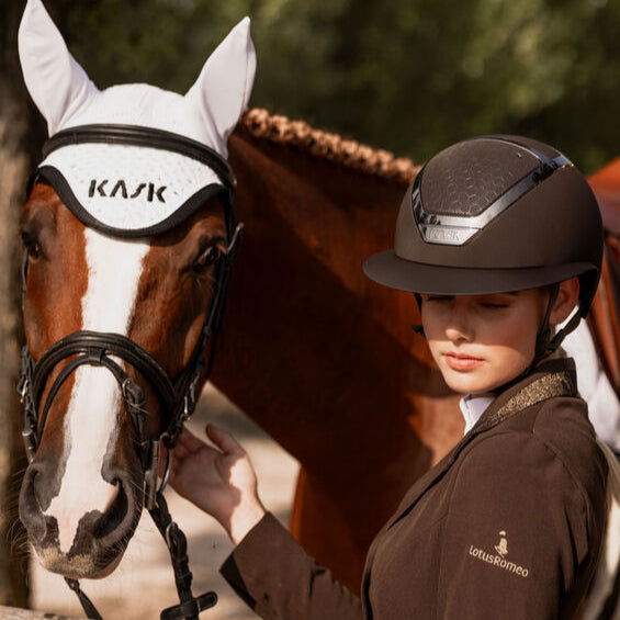 KASK Equestrian Star Lady Chrome Helmet - Brown tone-on-tone, shown on rider next to horse | Malvern Saddlery