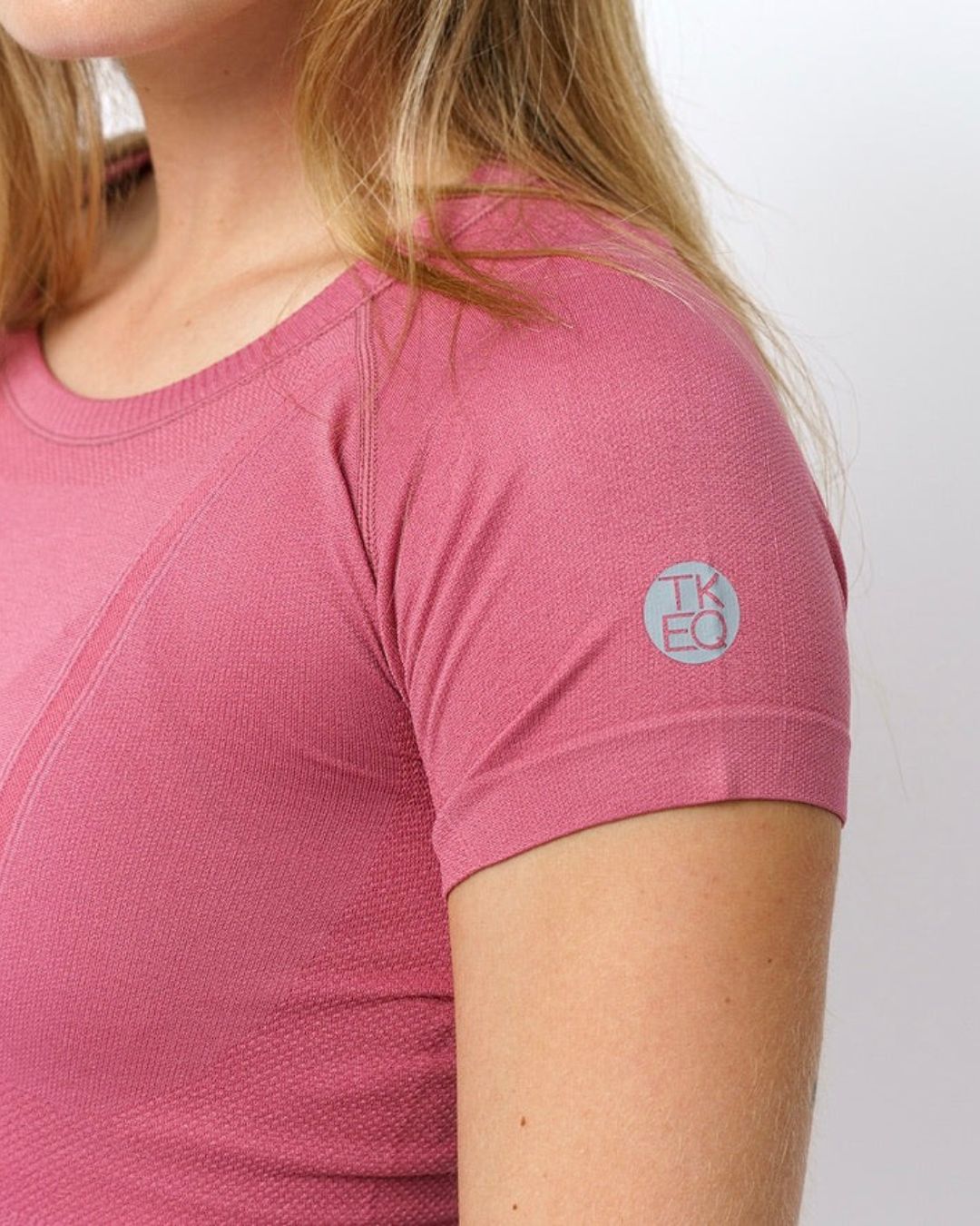 TKEQ Kennedy Seamless 2.0 Short Sleeve Shirt - Cupid Pink, sleeve detail | Equestrian Training Shirts | Malvern Saddlery