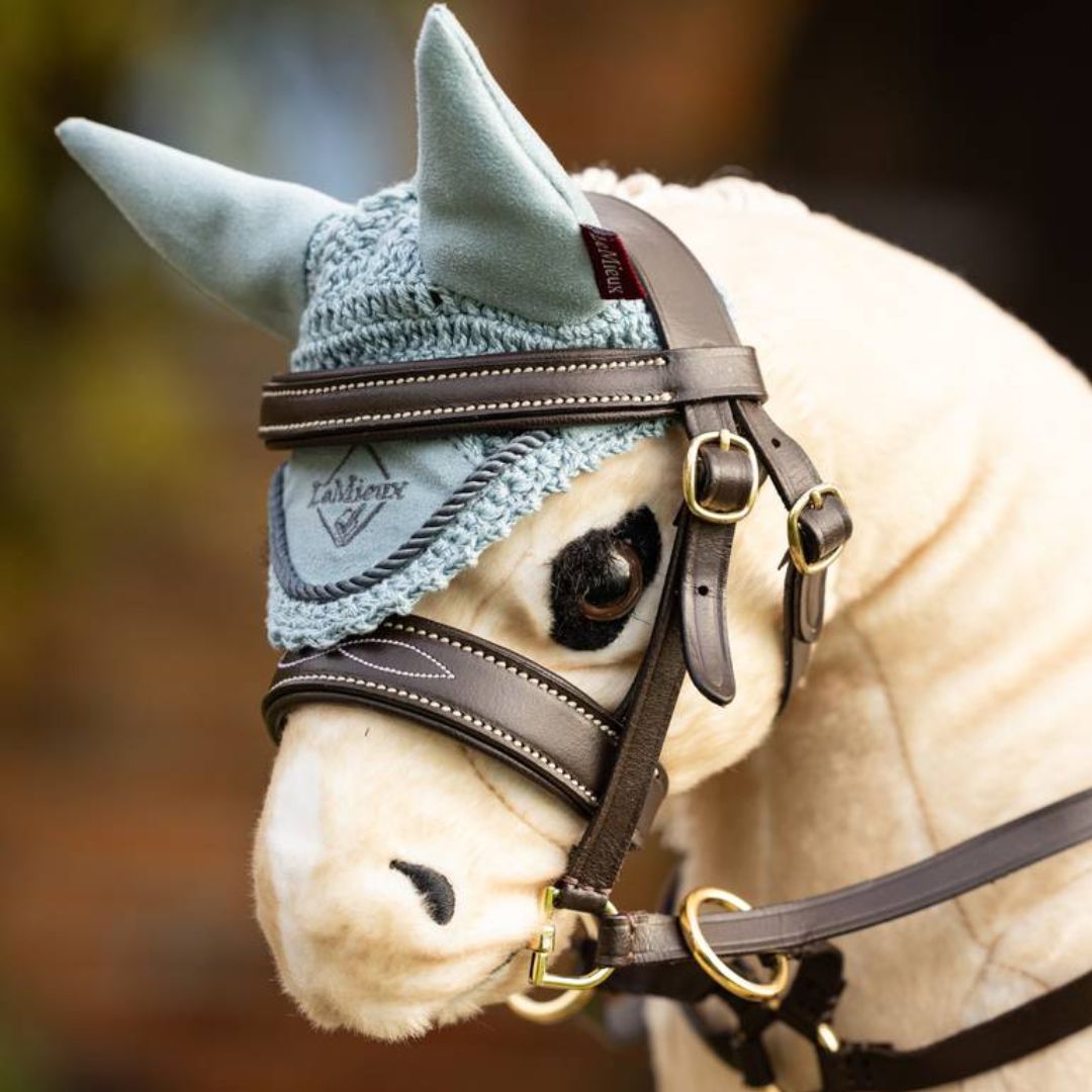 LeMieux Toy Pony Crochet Fly Bonnet - Glacier, shown on Popcorn with bridle | Malvern Saddlery