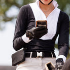 Veltri Sports Large Eaton Belt Bag, lifestyle image shown on rider holding cell phone in hand | Malvern Saddlery