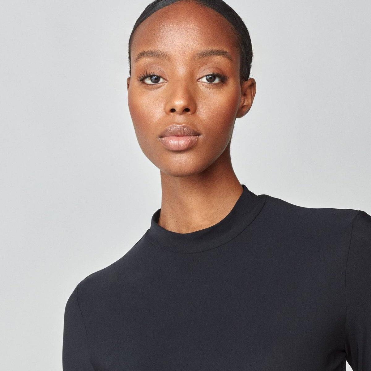 Yagya Women's Lightweight Long Sleeve Riding Top - Black, mock neck close-up | Malvern Saddlery