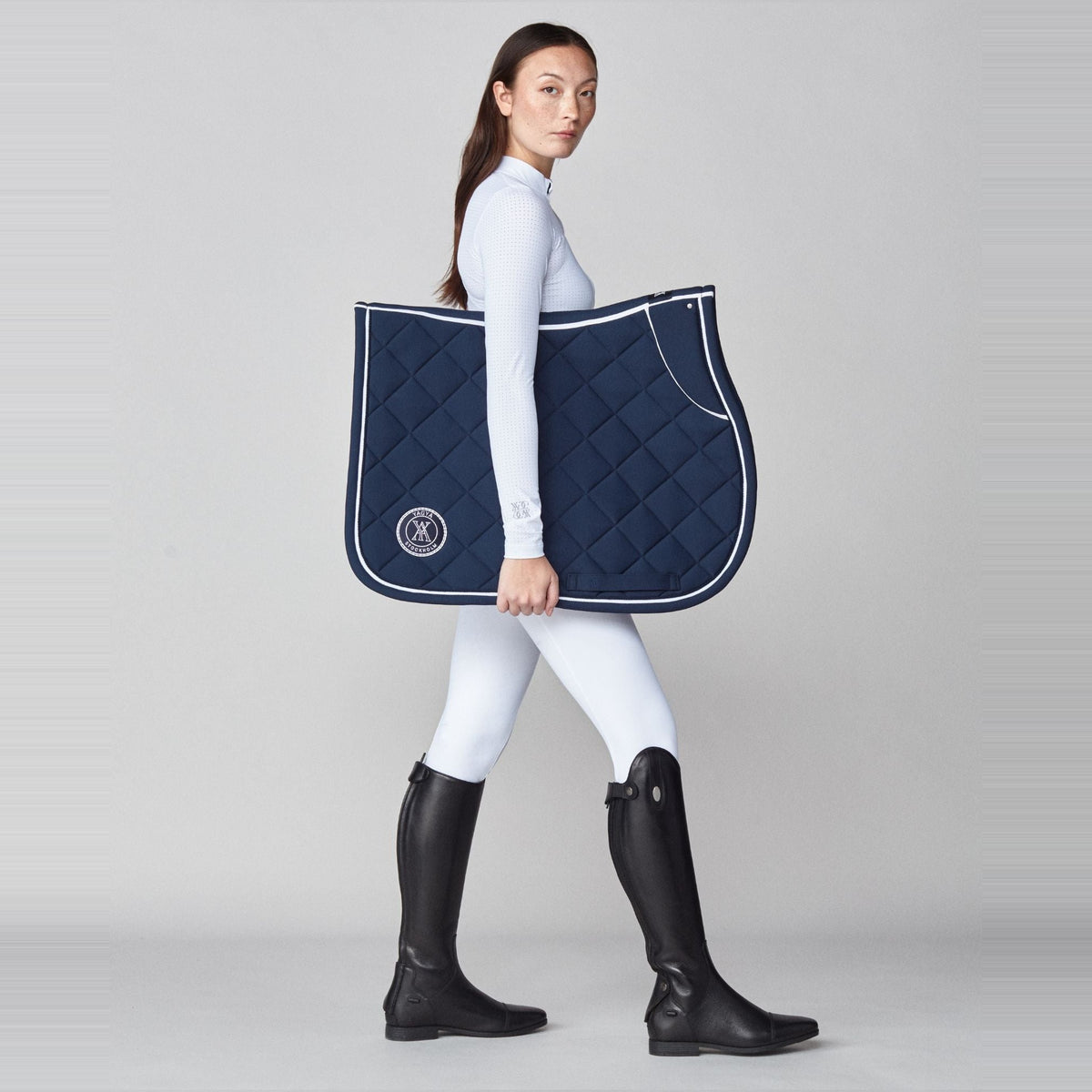 Yagya Performance Jump Saddle Pad - Navy, full length with model | Malvern Saddlery